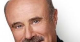 Dr. Phil, renowned host and psychologist, smiles confidently in a tailored black suit with a friendly demeanor.