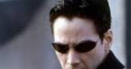 Neo from The Matrix wearing sunglasses, in a dramatic pose, embodying his iconic role as the chosen one.