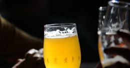 Golden beer in a stylish glass on a wooden table, capturing the essence of craft brews and the Dunk Effect.