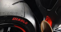 Close-up of a motorcycle tire and exhaust, showcasing sleek design and performance features for racing enthusiasts.