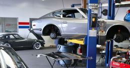 Classic cars being serviced in a modern auto mechanic shop, showcasing tools, lifts, and detailed engine work.