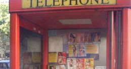 Red telephone booth with ads, showcasing a payphone ideal for prank calls in urban settings.