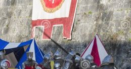 Medieval sword fight between armored knights, showcasing combat skills in a historical reenactment on a grassy field.