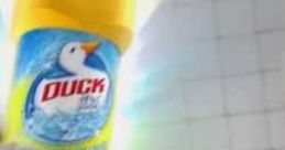 Duck cleaning product in a brightly-lit bathroom, highlighting effective stain removal with the tagline "Spray N Wipe.