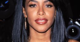 Aaliyah shown with long black hair, wearing a floral dress, capturing her timeless beauty at a 1990s event.