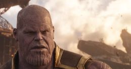 Thanos stands menacingly in a battle-worn landscape, showcasing his imposing figure and complex character in "The Old Man.