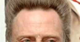 Christopher Walken with distinctive hairstyle at event, known for his comedic roles and memorable prank call performances.