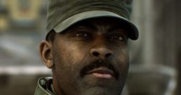 Sergeant Avery Johnson from Halo, wearing UNSC armor and a cap, gazes confidently amidst a battle scene.