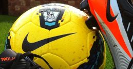 Nike soccer cleats and a vibrant Premier League ball resting on grass, ideal for Adidas Power Soccer enthusiasts.