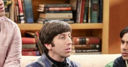 Howard Wolowitz using a laptop with friends in a cozy living room, surrounded by books, showcasing their witty interactions.