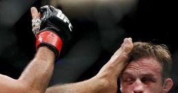 Fighter receiving a powerful punch in the UFC, showcasing intense action in mixed martial arts competition.