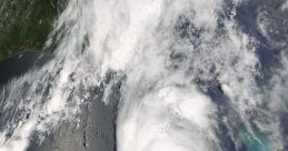 Satellite view of a powerful hurricane forming over the Gulf of Mexico, showcasing distinct cloud patterns and intensity.