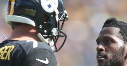 Pittsburgh Steelers players engaged in serious discussion on the field during a game, showcasing teamwork and strategy.