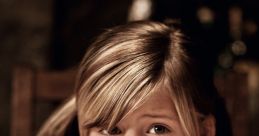 Concerned girl resting her head on a wooden table, expressing uncertainty, perfect for showcasing childhood emotions.