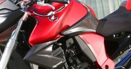 Red and black sports bike with sleek design and modern features, showcasing its powerful engine and performance aspects.