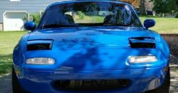 Miata The unmistakable of a revving engine fills the air as a Mazda Miata speeds down the open road. The Miata Song, a