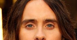 Jared Leto with long hair and a beard, wearing a red bow tie, portraying Jesus in Family Guy episodes.