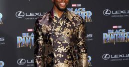 Chadwick Boseman at the Black Panther premiere, showcasing stylish attire and a vibrant smile on the purple carpet.