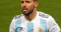 Aguero in Argentina's national team jersey, showcasing his intensity during a match, highlighting his football skills.