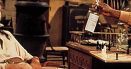 Two characters from Blazing Saddles engage in a humorous scene involving a drink and a chess game in a rustic setting.