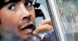 Colin Farrell trapped in a phone booth, with tense expressions and a shattered glass backdrop, from the movie "Phone Booth.