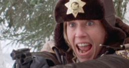 Police officer in Fargo, armed and shouting, stands ready to confront danger in a snowy landscape.