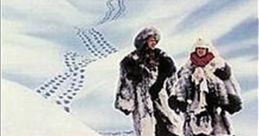 Chevy Chase and Dan Aykroyd in winter attire for the comedy film "Spies Like Us," set against a snowy landscape.