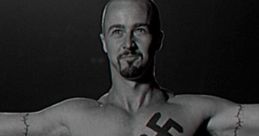 Character from American History X displays a Nazi swastika tattoo, symbolizing themes of hate and redemption.