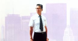 Man in business attire stands on a graffiti-covered step, symbolizing chaos in the film "Falling Down."