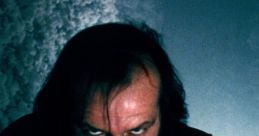 Jack Nicholson's intense expression in "The Shining," capturing the film's chilling atmosphere and psychological horror.