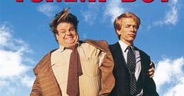 Tommy Boy movie poster featuring Chris Farley and David Spade on a country road, capturing their comedic journey.