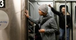 Man exiting NYC Subway train, with fellow passengers visible, capturing the city's vibrant transit atmosphere.