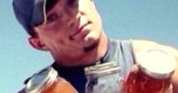 Young man in a sleeveless shirt holding three jars, showcasing a Louisiana redneck lifestyle outdoors.