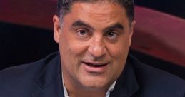 Cenk Uygur gestures while speaking during a discussion, showcasing his passion for political commentary and advocacy.