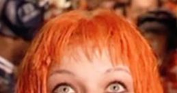 Leeloo from "The Fifth Element" gazes upwards, showcasing her vibrant orange hair and striking blue eyes in a vivid scene.