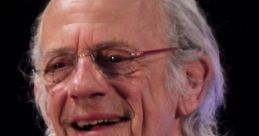 Christopher Lloyd smiles during a public appearance, showcasing his iconic style and charisma. Renowned actor and director.