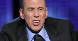 Gilbert Gottfried performing passionately on stage, capturing his signature comedic style and unique expressions.