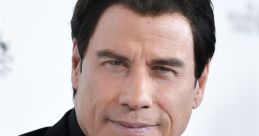 John Travolta smiling confidently in a black suit, showcasing his timeless style at a red carpet event.