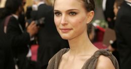 Natalie Portman stunning in a plunging neckline dress, showcasing elegance at a prestigious red carpet event.