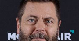 Nick Offerman with a beard, wearing a black shirt, at the Montclair Film Festival 2018, displaying his signature look.