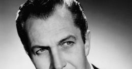 Vincent Price, iconic actor known for his roles in horror films, poses elegantly in a classic black and white photo.