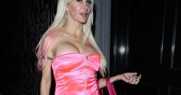 Frenchy flaunts a vibrant pink dress and matching accessories while strolling down the street at night, exuding confidence.