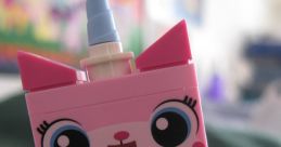 Colorful LEGO figure of Princess Unikitty with a blue horn, big eyes, and a cheerful expression, perfect for imaginative play.