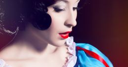 Snow White in vibrant costume, holding a red apple, embodying the classic fairy tale character’s iconic image.