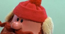 Yukon Cornelius, the iconic adventurer, known for his red hat and fluffy beard, embodies holiday spirit and bravery.