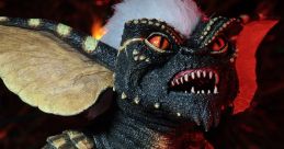 Detailed close-up of a Gremlin figure with fierce expression, showcasing its unique features and textured skin under festive lights.