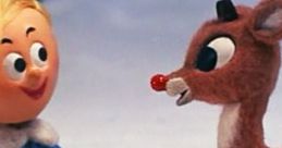 Hermey the Elf and Rudolph the Red-Nosed Reindeer share a moment in a winter wonderland from the classic 1964 holiday special.