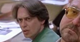 Close-up of characters from "The Big Lebowski" in a bowling alley, showcasing expressive facial reactions and iconic outfits.