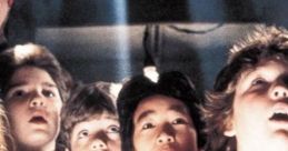 Young adventurers from "The Goonies" express awe in a dramatic scene, highlighting friendship and excitement.