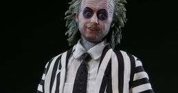 Beetlejuice figure in iconic black and white striped suit, showcasing the character's quirky and mischievous persona.